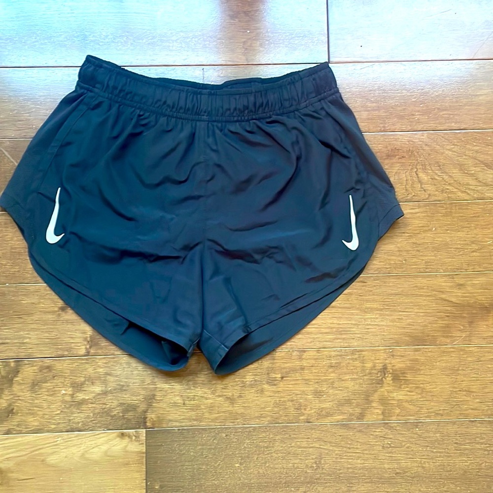 Black Nike athletic shorts with attached underwear
